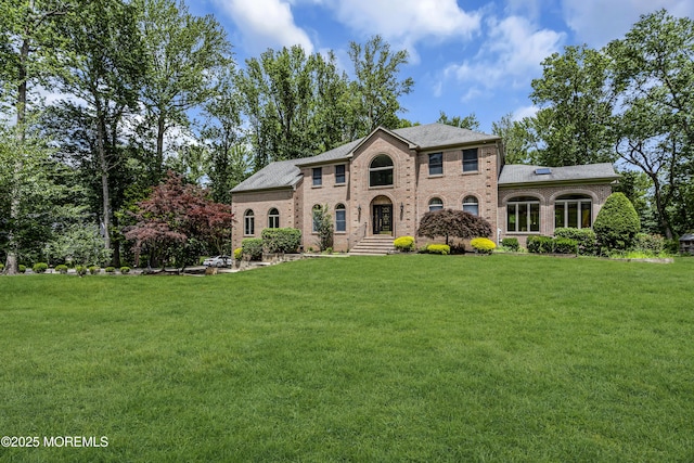 2 Shady Oak Ct, Millstone, NJ 08535 - colonial inspired home featuring brick siding and a front yard