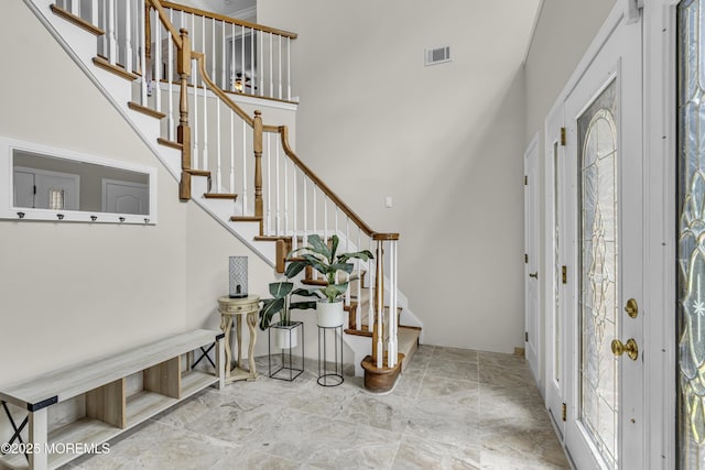 2 Shady Oak Ct, Millstone, NJ 08535 - entryway with stairs, a towering ceiling, and stone finish floors