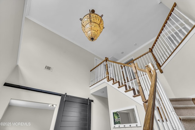2 Shady Oak Ct, Millstone, NJ 08535 - stairway featuring crown molding, a barn door, and a high ceiling