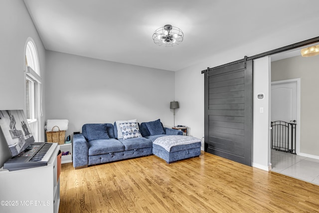 2 Shady Oak Ct, Millstone, NJ 08535 - living room featuring a barn door and wood finished floors