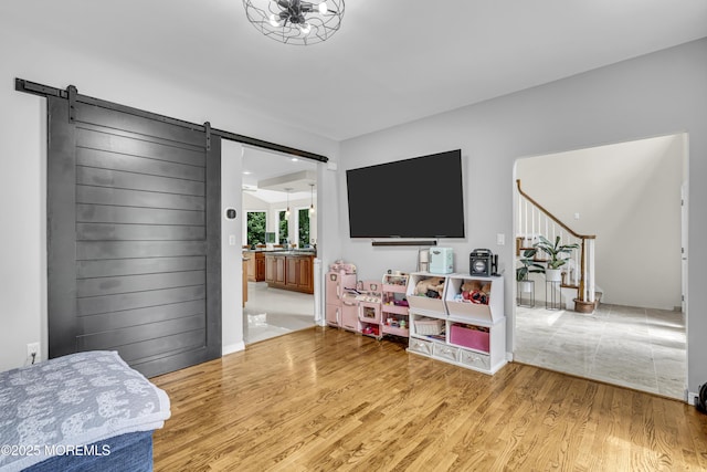 2 Shady Oak Ct, Millstone, NJ 08535 - bedroom featuring a barn door, wood finished floors, and ensuite bath