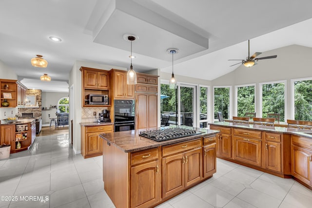 2 Shady Oak Ct, Millstone, NJ 08535 - kitchen featuring gas cooktop, ceiling fan, backsplash, stainless steel microwave, and a kitchen island