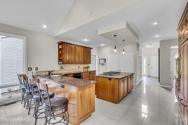 2 Shady Oak Ct, Millstone, NJ 08535 - kitchen with open shelves, backsplash, a peninsula, brown cabinetry, and a kitchen breakfast bar