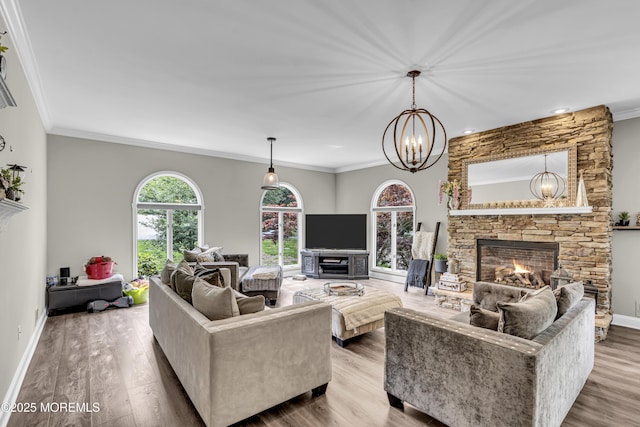 2 Shady Oak Ct, Millstone, NJ 08535 - living room featuring a fireplace, a chandelier, wood finished floors, crown molding, and recessed lighting