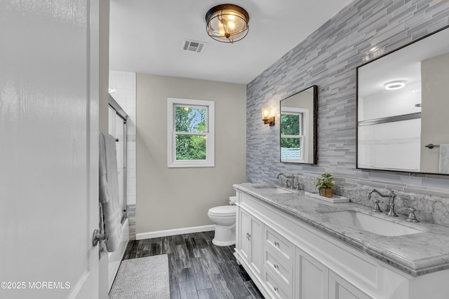 2 Shady Oak Ct, Millstone, NJ 08535 - bathroom with double vanity, wood finished floors, and bath / shower combo with glass door