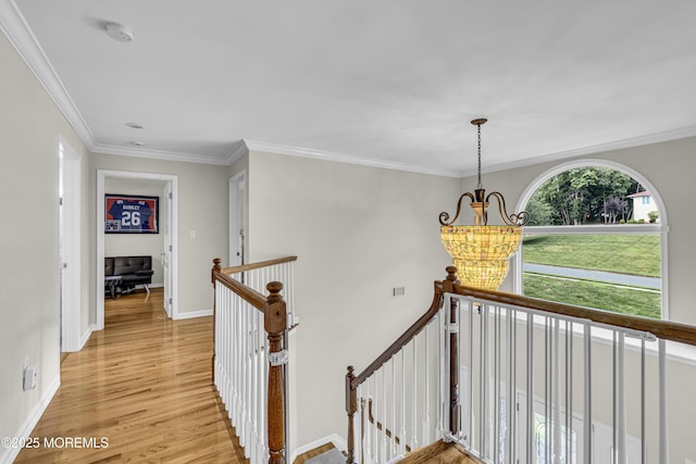 2 Shady Oak Ct, Millstone, NJ 08535 - hall featuring an upstairs landing, light wood finished floors, a chandelier, and crown molding