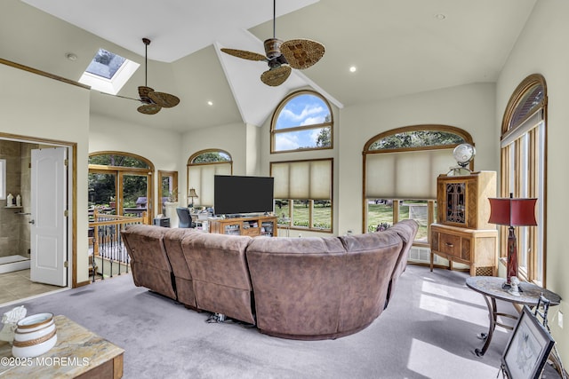 2 Shady Oak Ct, Millstone, NJ 08535 - carpeted living area with ceiling fan, a skylight, and high vaulted ceiling