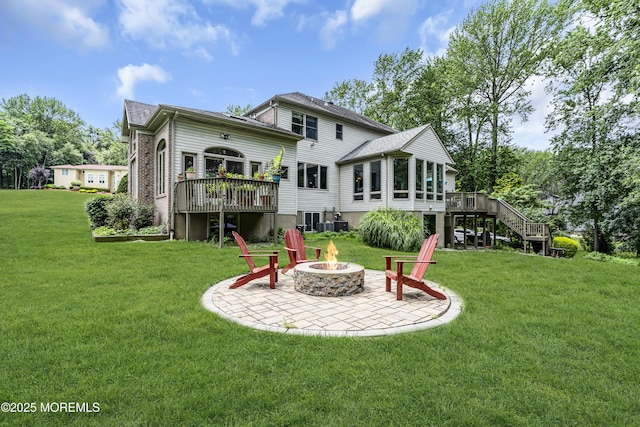 2 Shady Oak Ct, Millstone, NJ 08535 - rear view of house featuring a fire pit, a wooden deck, a yard, stairway, and a patio area