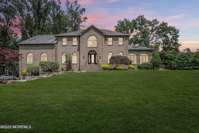 2 Shady Oak Ct, Millstone, NJ 08535 - colonial home featuring a lawn, brick siding, and a shingled roof