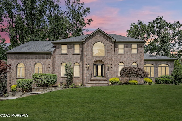 2 Shady Oak Ct, Millstone, NJ 08535 - view of front of home with a lawn, brick siding, and a shingled roof