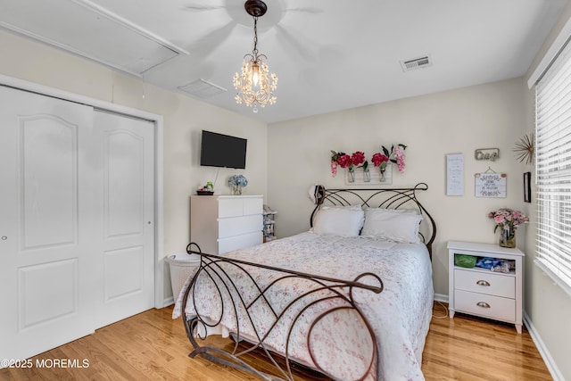 2 Shady Oak Ct, Millstone, NJ 08535 - bedroom featuring attic access, light wood-style flooring, and a closet