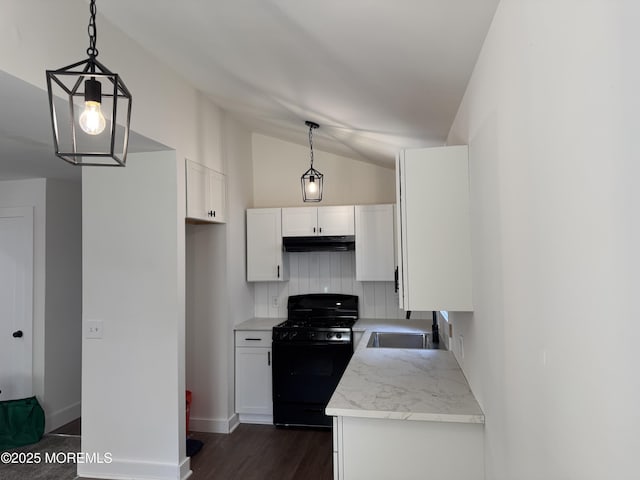 17 Mayfair Ct, Brick, NJ 08723 - kitchen featuring black gas stove, under cabinet range hood, vaulted ceiling, white cabinetry, and dark wood finished floors