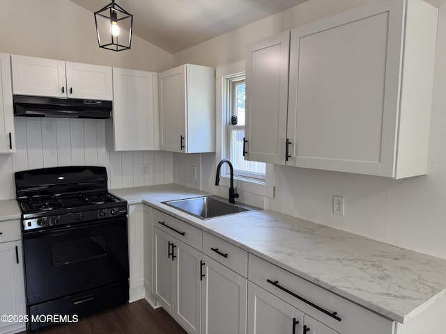 17 Mayfair Ct, Brick, NJ 08723 - kitchen with black gas stove, under cabinet range hood, white cabinets, light stone countertops, and dark wood-type flooring