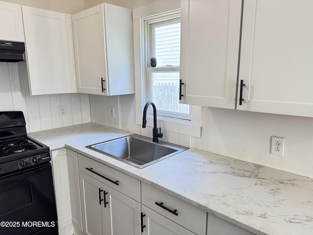 17 Mayfair Ct, Brick, NJ 08723 - kitchen with black range with gas cooktop, white cabinets, healthy amount of natural light, and range hood