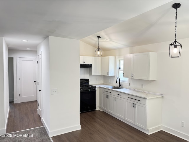 17 Mayfair Ct, Brick, NJ 08723 - kitchen with gas stove, under cabinet range hood, dark wood-type flooring, white cabinets, and recessed lighting