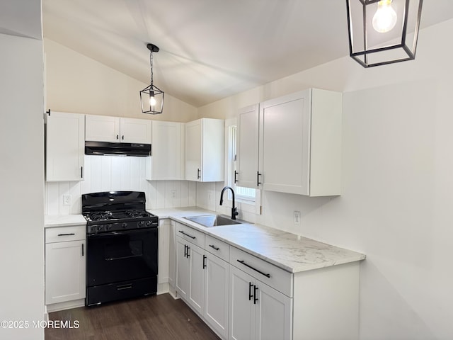 17 Mayfair Ct, Brick, NJ 08723 - kitchen with black gas stove, under cabinet range hood, vaulted ceiling, white cabinetry, and dark wood-style flooring