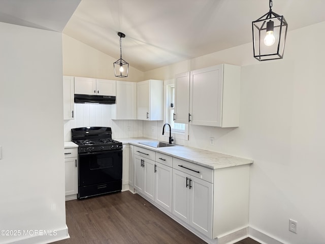 17 Mayfair Ct, Brick, NJ 08723 - kitchen featuring black gas range oven, under cabinet range hood, white cabinetry, dark wood-style floors, and vaulted ceiling