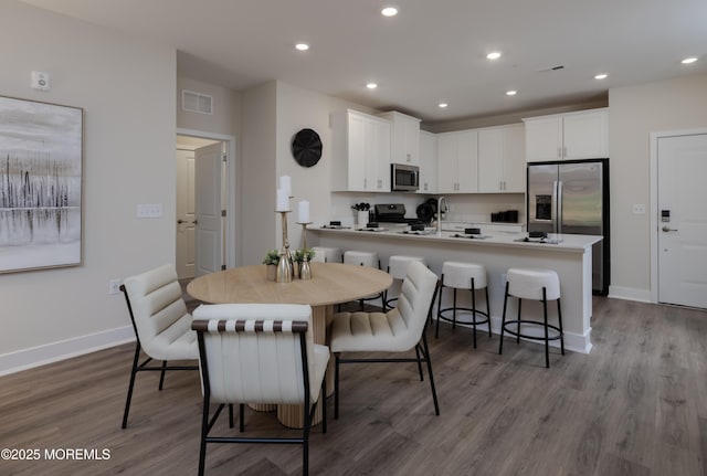 28202 Radford Ct, Monroe, NJ 08831 - dining area featuring dark wood-style flooring and recessed lighting