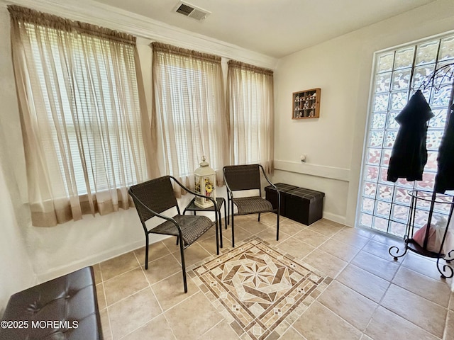 38 Crescent St, Keansburg, NJ 07734 - living area with light tile patterned flooring and ornamental molding