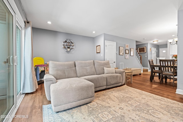 7 Steeple Chase Ct, Tinton Falls, NJ 07724 - living room with stairway, wood finished floors, and recessed lighting