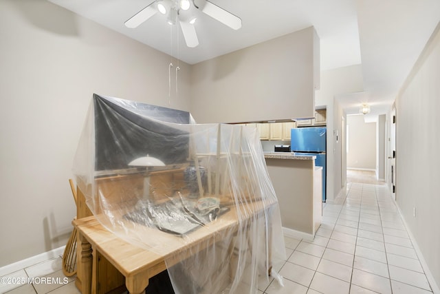 200 Paterson Plank Rd Unit 302, Union City, NJ 07087 - kitchen with light tile patterned flooring, freestanding refrigerator, a ceiling fan, and light countertops