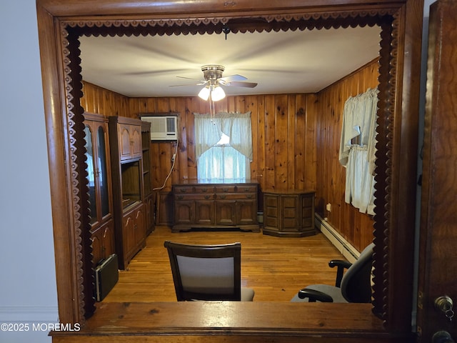 10 Weston Pl, Eatontown, NJ 07724 - office featuring baseboard heating, light wood-style flooring, a ceiling fan, wood walls, and a wall unit AC