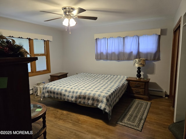 10 Weston Pl, Eatontown, NJ 07724 - bedroom with wood finished floors, a baseboard heating unit, baseboard heating, and ceiling fan