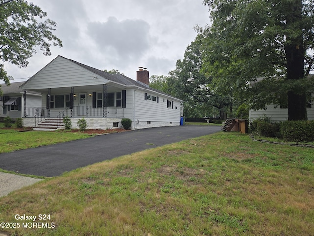10 Weston Pl, Eatontown, NJ 07724 - ranch-style house featuring covered porch, a chimney, and a front yard