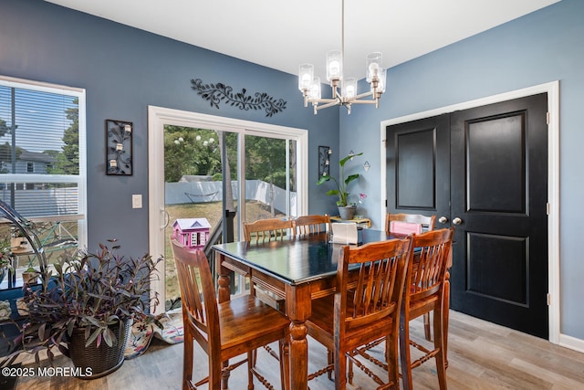 107 Sandpiper Ln, Little Egg Harbor, NJ 08087 - dining area with a chandelier and light wood-style flooring
