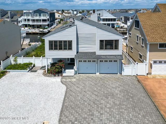 1856 Mill Creek Rd, Beach Haven West, NJ 08050 - view of front facade featuring a gate, a residential view, an attached garage, decorative driveway, and a shingled roof
