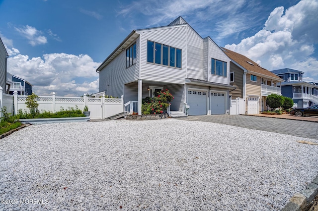 1856 Mill Creek Rd, Beach Haven West, NJ 08050 - view of front facade with an attached garage, driveway, and a residential view