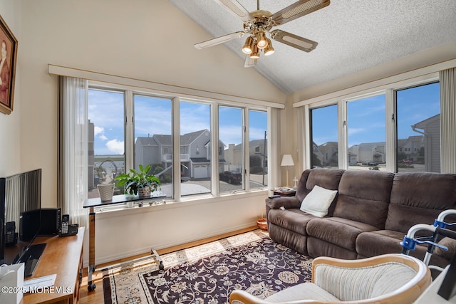 1856 Mill Creek Rd, Beach Haven West, NJ 08050 - living room with lofted ceiling, a ceiling fan, wood finished floors, and healthy amount of natural light