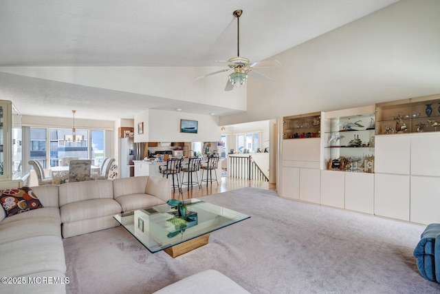 1856 Mill Creek Rd, Beach Haven West, NJ 08050 - living room featuring lofted ceiling, ceiling fan, a chandelier, and carpet flooring