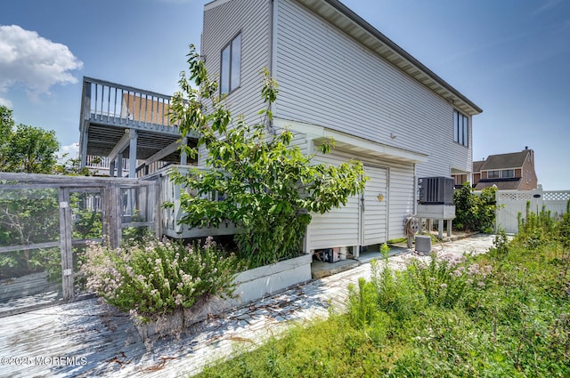1856 Mill Creek Rd, Beach Haven West, NJ 08050 - view of side of home with a deck and a central air condition unit