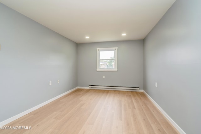 8 Phillips Rd, Brick, NJ 08724 - empty room featuring a baseboard heating unit, light wood finished floors, and recessed lighting