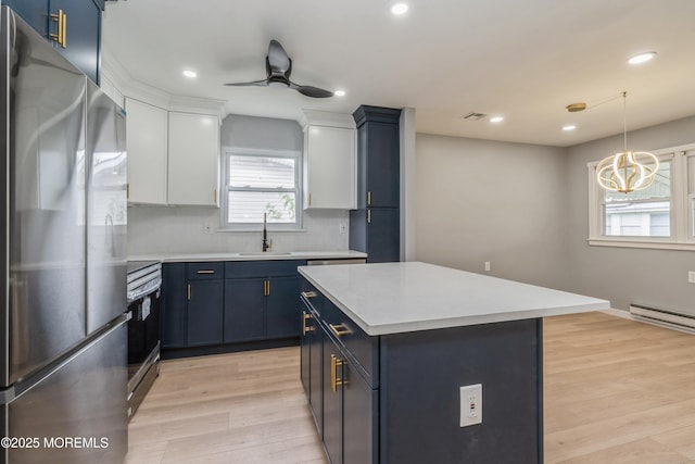 8 Phillips Rd, Brick, NJ 08724 - kitchen featuring appliances with stainless steel finishes, blue cabinets, light countertops, tasteful backsplash, and recessed lighting