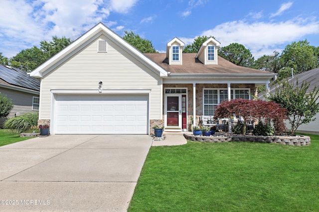 45 Marigold Ln, Little Egg Harbor, NJ 08087 - view of front facade with a front yard, stone siding, driveway, a garage, and covered porch