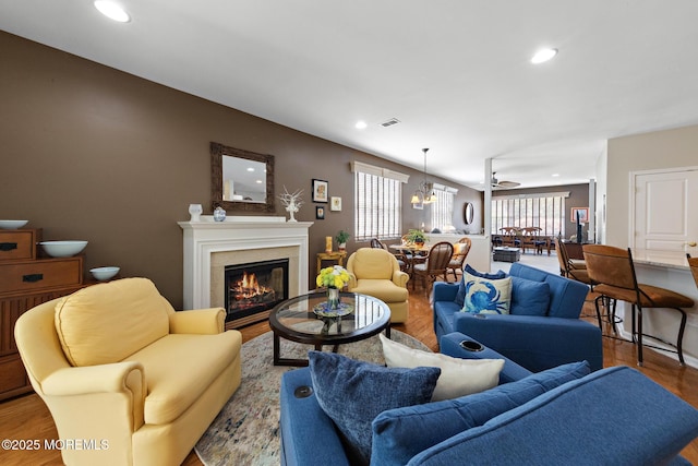 45 Marigold Ln, Little Egg Harbor, NJ 08087 - living room featuring wood finished floors, a glass covered fireplace, and recessed lighting
