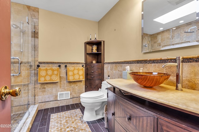14 Copperfield Ct, Eatontown, NJ 07724 - bathroom with tile walls, vanity, a shower stall, wainscoting, and wood finished floors