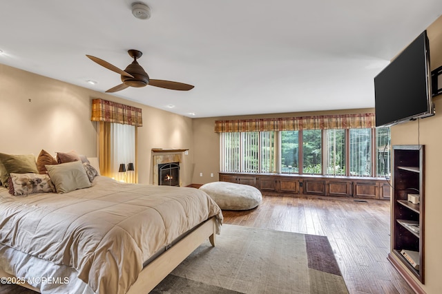 14 Copperfield Ct, Eatontown, NJ 07724 - bedroom with wood-type flooring, a lit fireplace, recessed lighting, and a ceiling fan