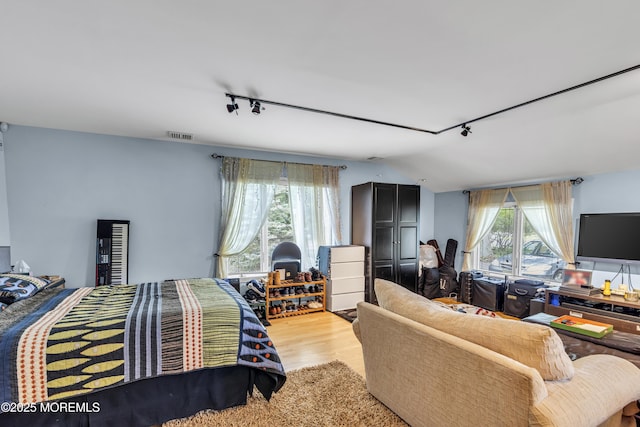 14 Copperfield Ct, Eatontown, NJ 07724 - bedroom with rail lighting and light wood-style floors