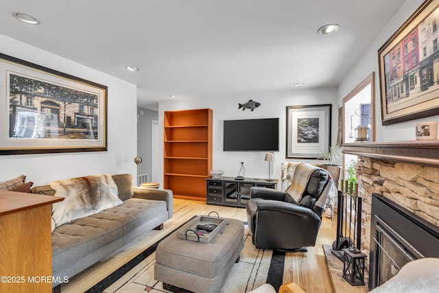 14 Copperfield Ct, Eatontown, NJ 07724 - living room featuring wood finished floors, a stone fireplace, and recessed lighting
