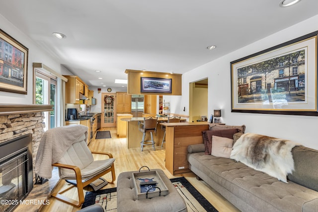 14 Copperfield Ct, Eatontown, NJ 07724 - living room featuring light wood-type flooring, a stone fireplace, and recessed lighting