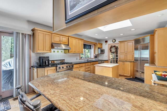 14 Copperfield Ct, Eatontown, NJ 07724 - kitchen featuring a skylight, light brown cabinetry, a center island, and recessed lighting