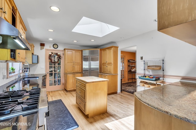 14 Copperfield Ct, Eatontown, NJ 07724 - kitchen featuring a skylight, light wood-style floors, butcher block countertops, built in fridge, and recessed lighting