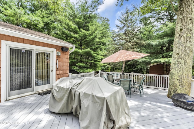 14 Copperfield Ct, Eatontown, NJ 07724 - wooden deck with outdoor dining area, a grill, and a shed