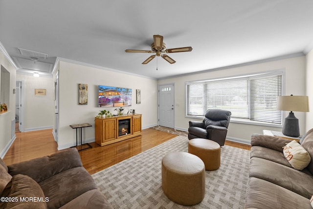 72 Broadway Rd, Freehold, NJ 07728 - living area with crown molding, a ceiling fan, attic access, and light wood-type flooring