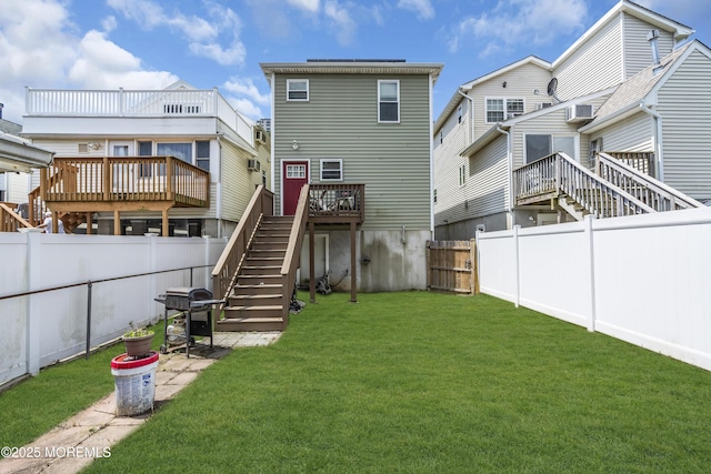 13 Locust St, Highlands, NJ 07732 - back of property with stairs, a fenced backyard, a deck, and a patio area