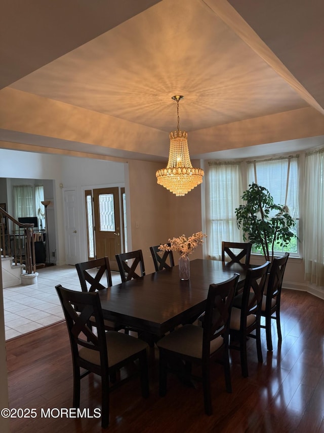 67 Erin Dr, Jackson, NJ 08527 - dining area featuring a chandelier, healthy amount of natural light, stairway, and wood finished floors
