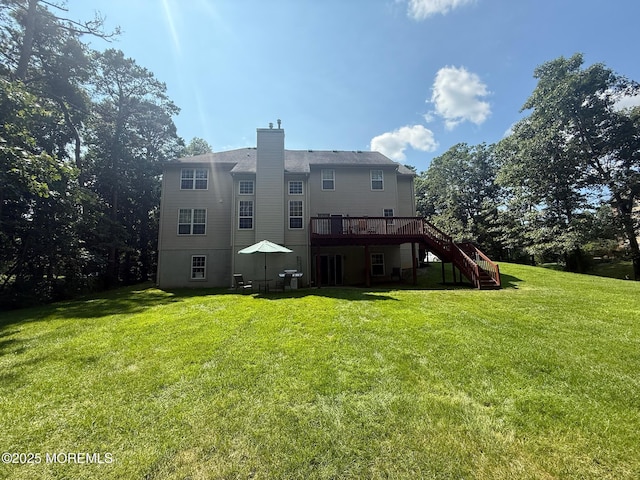 67 Erin Dr, Jackson, NJ 08527 - back of property with stairway, a wooden deck, a chimney, and a lawn